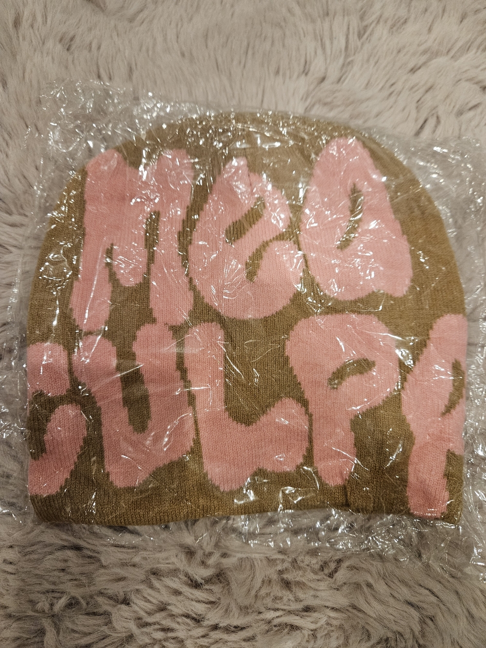 Pink Script Beanie on Olive Background